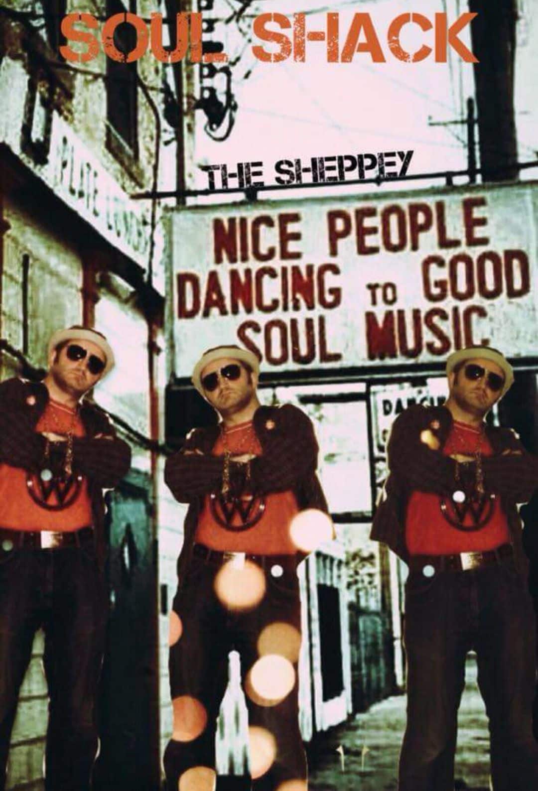 Three men in similar retro outfits stand in front of a building with a large sign that says, “Nice people dancing to good soul music.” The words “Soul Shack” and “The Sheppey” appear at the top.