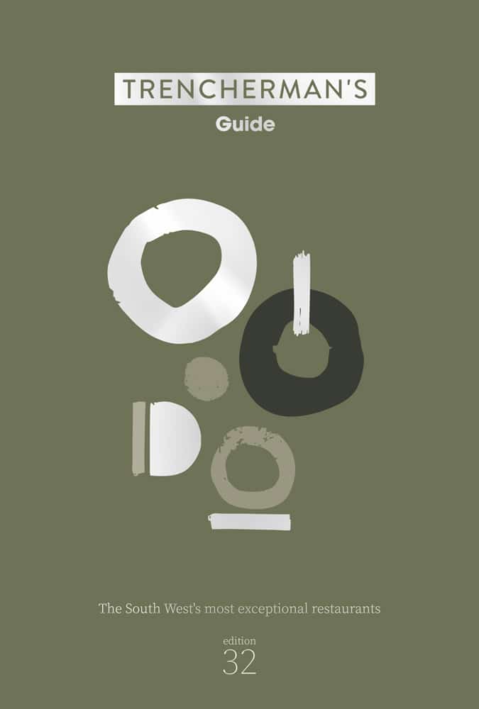 Cover of Trenchermans Guide edition 32, featuring abstract circular shapes in white and gray on an olive background, with text: The South West’s most exceptional restaurants.