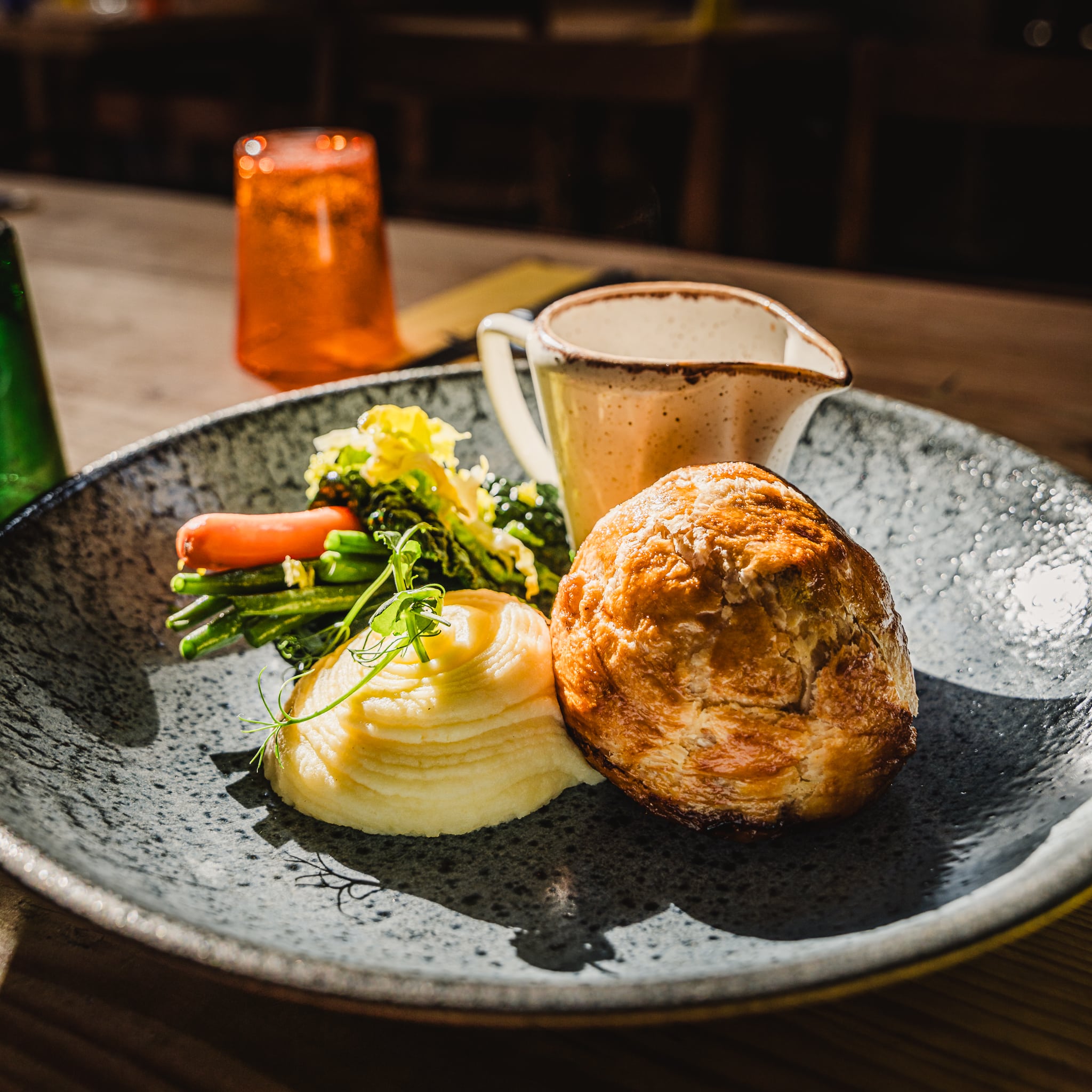 photo of a game pie with mash and veg
